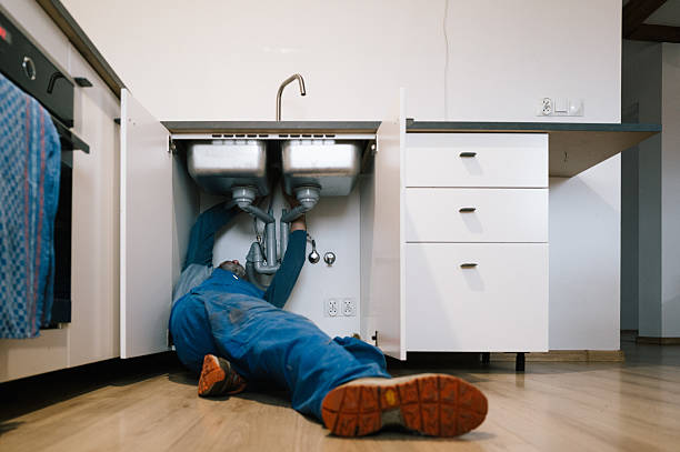 Professional Drain Cleaning technician working in East Elmhurst, NY